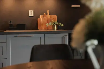 a kitchen counter with a wooden cutting board on it at Elegant apartment in Trysil Alpine Lodge in Trysil