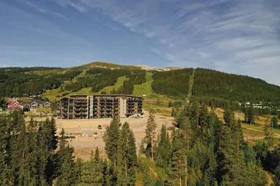 a large building in the middle of a mountain at Elegant apartment in Trysil Alpine Lodge in Trysil