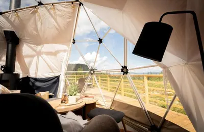 a room with a tent with a large window at Arctic Dome Gudbrandsdalen in Sør-Fron