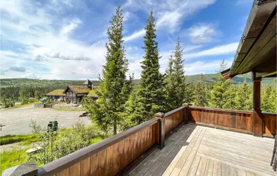 an outdoor deck with a view of a house at 4 Bedroom Beautiful Home In Nord-Torpa in Nord Torpa