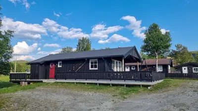 a black house with a black roof at Skurdalsvegen 37L in Geilo