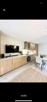 a large kitchen with a table and a dining room at Bjorli Apartment with everything, 150m from ski lift in Bjorli