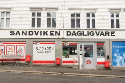 a restaurant on the side of a street at Dinbnb Apartments I Views & Street Parking in Sandviken in Bergen