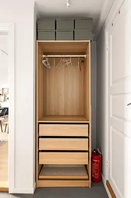 a closet with wooden drawers in a room at Dinbnb Apartments I Views & Street Parking in Sandviken in Bergen