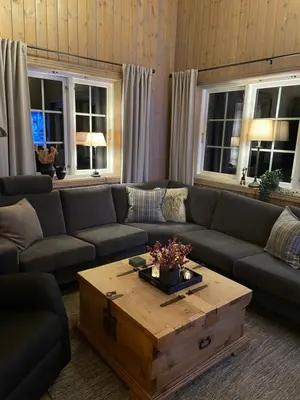 a living room with a couch and a coffee table at Leilighet i vakre Rauland in Rauland
