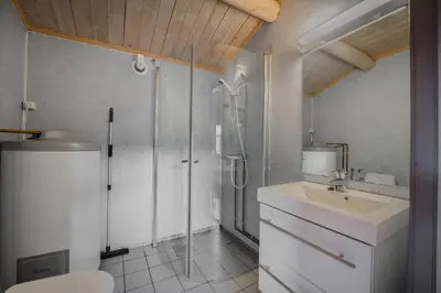 a bathroom with a toilet and a sink and a shower at Lillehammer Turistsenter Camping in Lillehammer