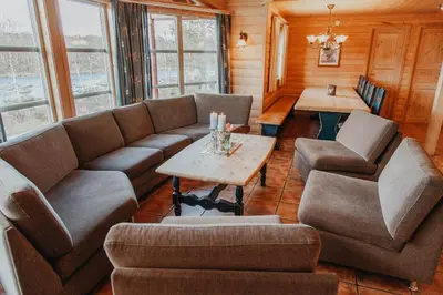 a living room with a couch and a table at Hovden Høyfjellsenter in Hovden