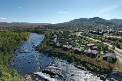an aerial view of a river and a town at Hovden Høyfjellsenter in Hovden
