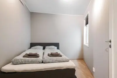 a bedroom with a bed with two pillows on it at Modern and central apartment in Bergen in Bergen