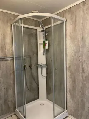a shower with a glass enclosure in a bathroom at Leilighet i Odda sentrum in Odda