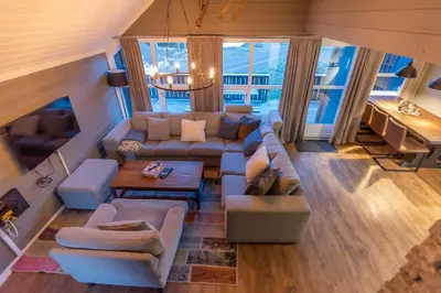 a living room with a couch and a table at Trysil Alpin 40A in Trysil