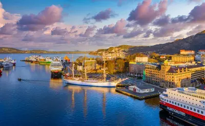 a group of boats docked in a harbor at Central Seafront Apartments with Parking and Self Check-In! in Bergen