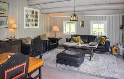a living room with a couch and a table at 4 Bedroom Nice Home In Hemsedal in Hemsedal