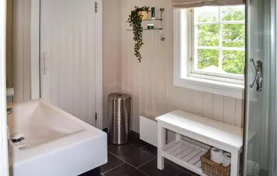 a bathroom with a white sink and a window at 4 Bedroom Nice Home In Hemsedal in Hemsedal
