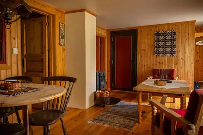 a living room with a table and a couch at Houmbgaarden in Røros