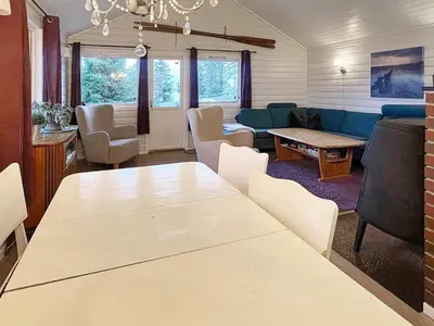 a living room with a table and a couch at 6 person holiday home in bremnes-By Traum in Bremnes