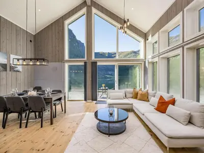 a living room with a white couch and a table at Holiday Home Mathias by Interhome in Vik