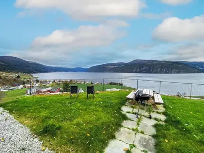 a view of a body of water with mountains in the background at Chalet Krampehaugen by Interhome in Utvik
