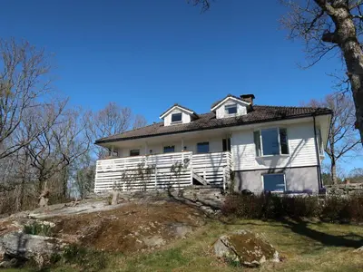 an old white house on top of a hill at Holiday Home Villa Hjartnes by Interhome in Hjartåker