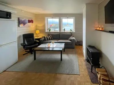 a living room with a couch and a table at Apartment Bakkafall by Interhome in Svortevik