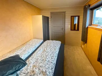 a bed in a small room with a window at Apartment Bakkafall by Interhome in Svortevik