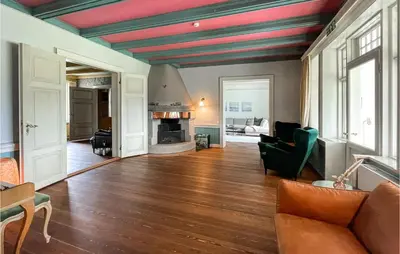a living room with a red and blue striped ceiling at Gorgeous Home In Koppang With Sauna in Koppang