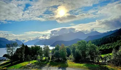 a view of a lake with mountains in the background at Panorama view in Stranda