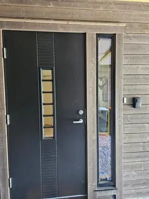 a black door with a window on a house at Panorama view in Stranda