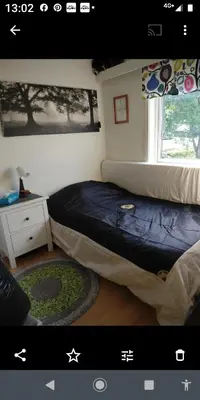 a bedroom with two beds and a window at Nardo-Trondheim in Trondheim