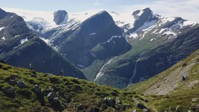 a view of a mountain valley with snow covered mountains at Olden Glamping - One with nature in Stryn