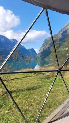 a view from the inside of a tent looking out at a valley at Olden Glamping - One with nature in Stryn