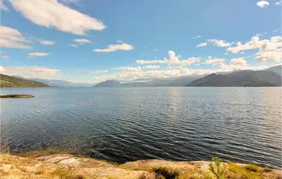 a large body of water with mountains in the background at Amazing Home In Tørvikbygd With Wifi in Tyrvikbygd