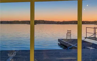 a view of a lake from a window at Stunning Home In Fitjar With Wifi in Fitjar