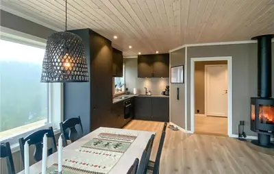 a kitchen and a dining room with a table and a dining room at Nice Home In Rauland With House A Mountain View in Rauland