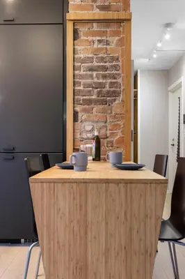 a wooden counter with two mugs on top of it at Dinbnb Apartments I New 2021 I Affordable Option in Bergen