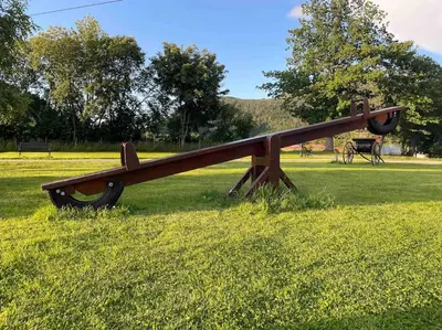 a large wooden airplane sculpture in a field at Nakkentunet - familievennlig hus på gårdstun. in Ørskog