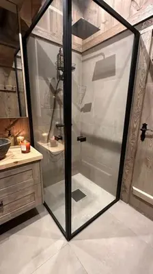 a shower with a glass door in a bathroom at Liaplassen Mountain Chalet - Beitostølen in Beitostøl