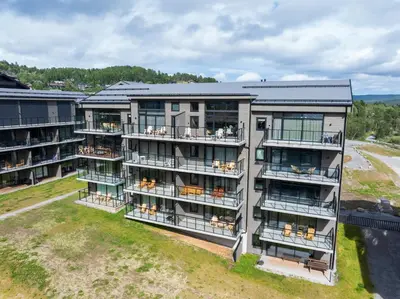 an aerial view of a apartment building with balconies at Spacious and modern apartment in the heart of Geilo, perfect year round! in Geilo