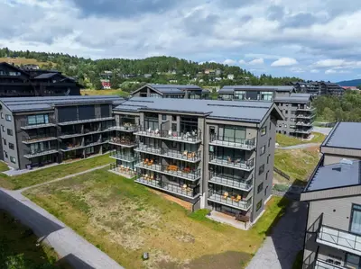 an aerial view of an apartment complex at Spacious and modern apartment in the heart of Geilo, perfect year round! in Geilo