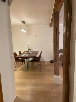 a dining room with a table and chairs at The old bakery in Sandviken in Bergen