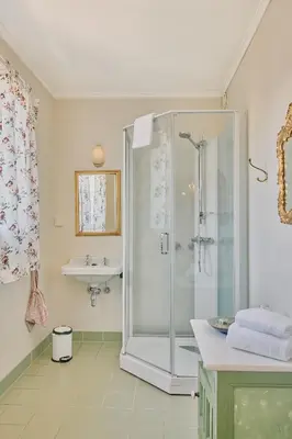 a bathroom with a shower and a sink at Visnes Hotel Stryn in Stryn