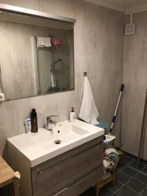 a bathroom with a white sink and a mirror at Åsgardane Gjestegard in Gol