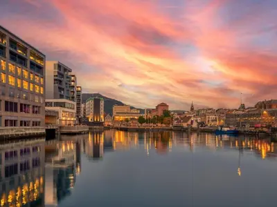 a view of a city with a river and buildings at Dinbnb Apartments I Historical Two-Floor Apartment with Rooftop Panorama I 1645 Heritage in Bergen