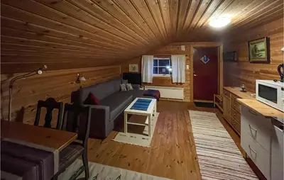 a living room with a couch and a table at 1 Bedroom Amazing Apartment In Trysil in Trysil