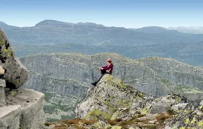 a woman sitting on top of a mountain at 3 Bedroom Amazing Home In Tuddal in Tuddal