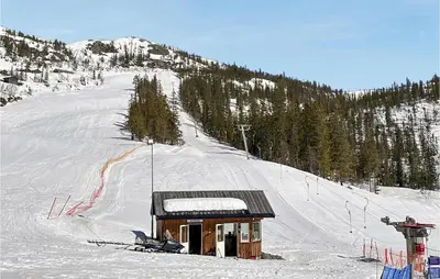 a small cabin in the snow on a ski slope at 3 Bedroom Amazing Home In Tuddal in Tuddal