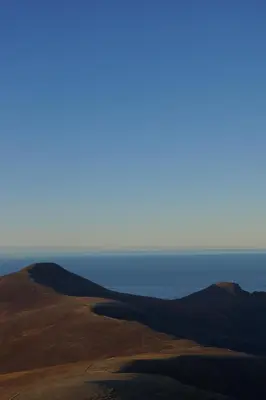 a view of the ocean from the top of a hill at Waterfront Rorbu - By the Beach in Bud