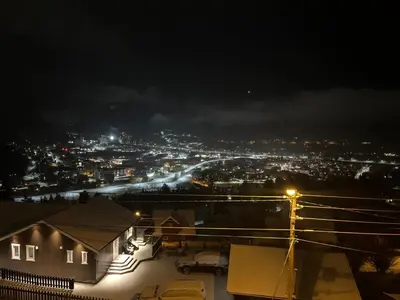 a view of a city at night with lights at Leilighet for korttidsleie in Otta