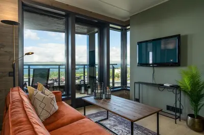 a living room with a couch and a table at Riddergaardens eleganse in Beitostøl