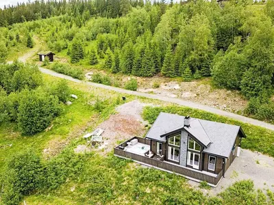 an aerial view of a house in the woods at 4 star holiday home in Fall-By Traum in Raufoss